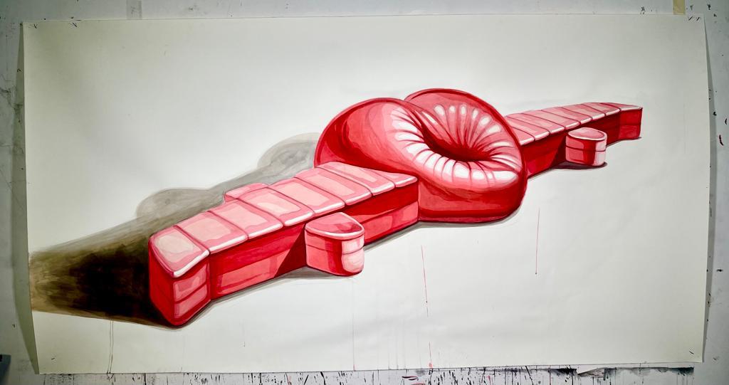 A design painting sketching the two-part red starburst-textured sculpture, on paper taped to a wall.